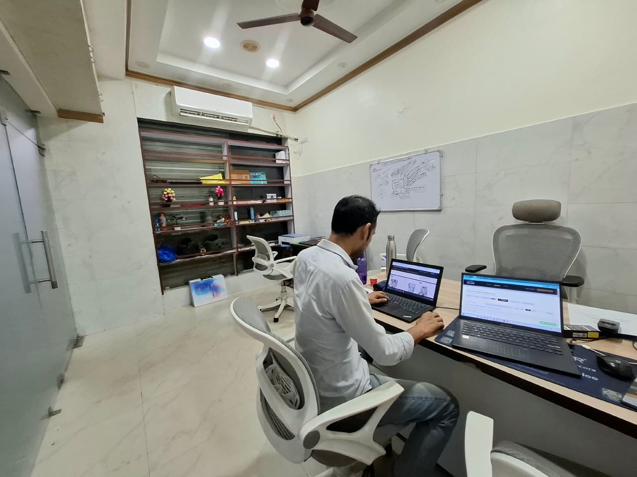 Property advisor actively reviewing listings on the central consultation desk