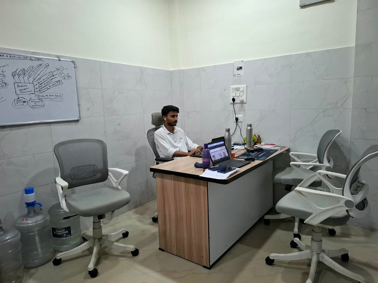 Client seating view facing the central consultation desk in the advisory suite